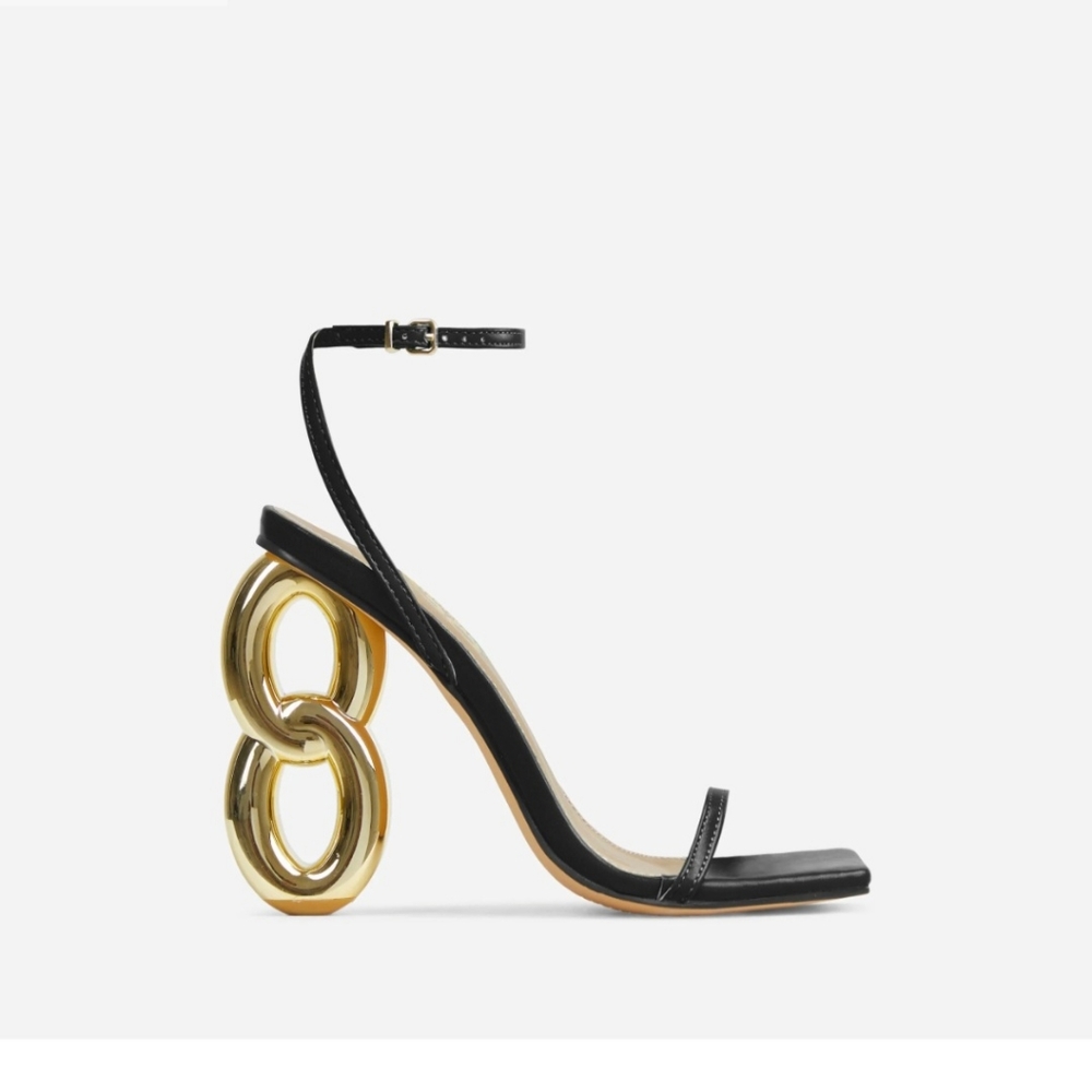 EGO Black Leather Ankle-Strap Sandals with Gold Sculptural Heel